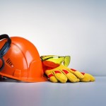 Work safety protection equipment on grey background with copy space. Horizontal banner.
