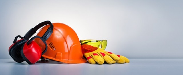 Work safety protection equipment on grey background with copy space. Horizontal banner.