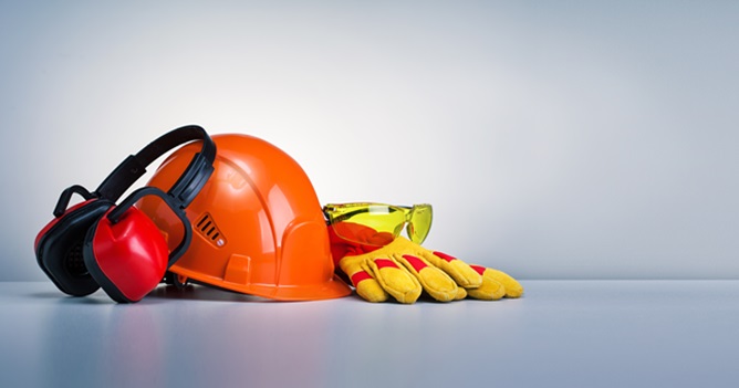 Work safety protection equipment on grey background with copy space. Horizontal banner.